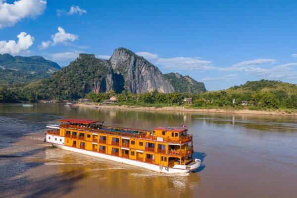 Aerial of boutique river cruise ship Mekong Star (Lernidee Erlebnisreisen) on Upper Mekong river with Pak Ou mountain behind, Pak Ou, Pak Ou District, Luang Prabang